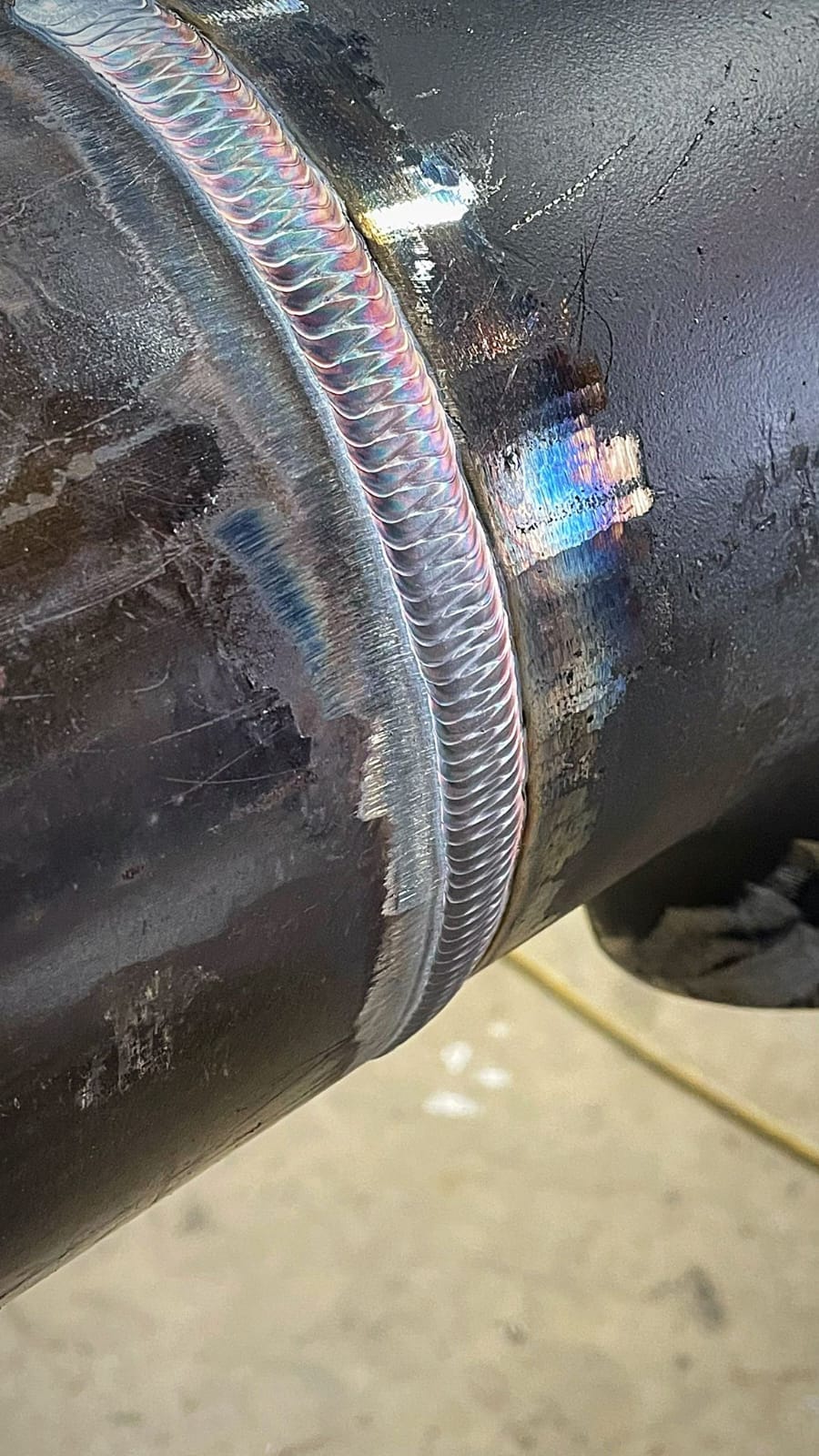 Certified welder from TAS Welder Mechanics executing precision weld joints on structural steel